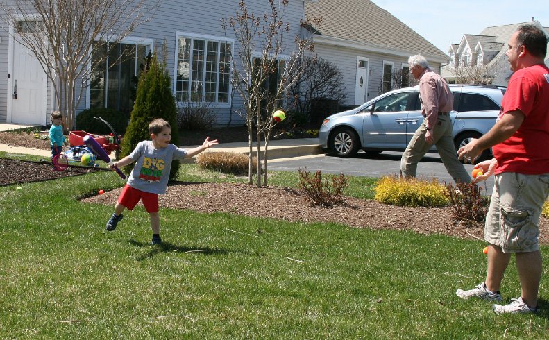 Tossing a ball to Daddy